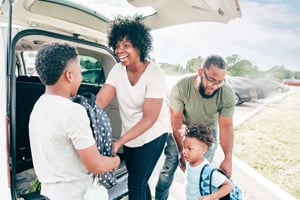 Happy family saving money on back-to-school shopping