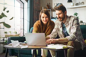 Couple doing estate planning on their laptop